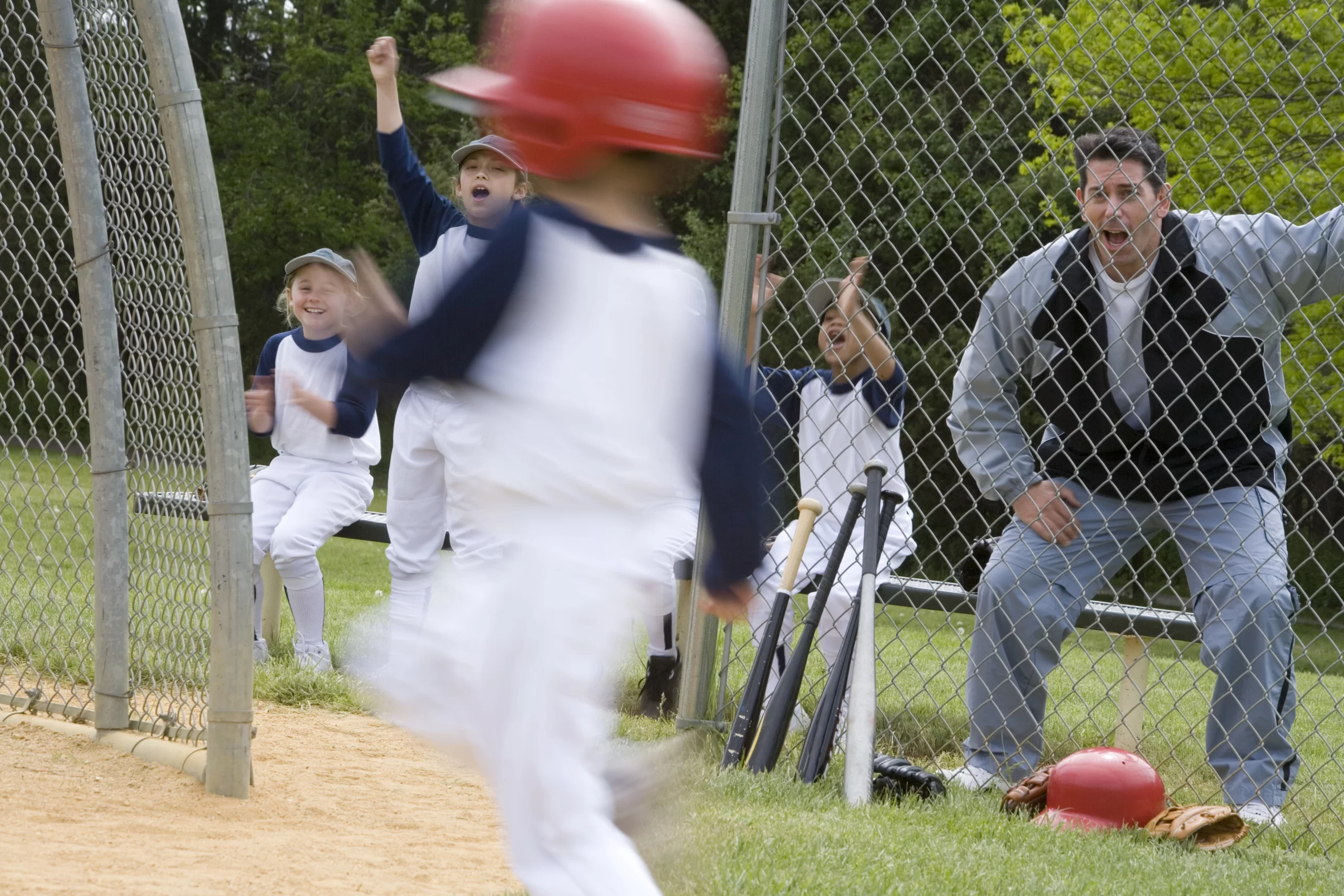 Parent cheering for his child during a game.