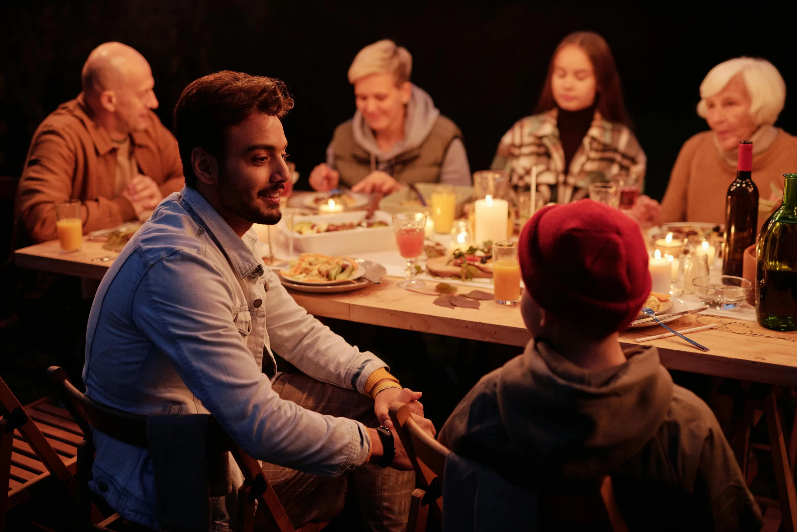 Family eating dinner together.