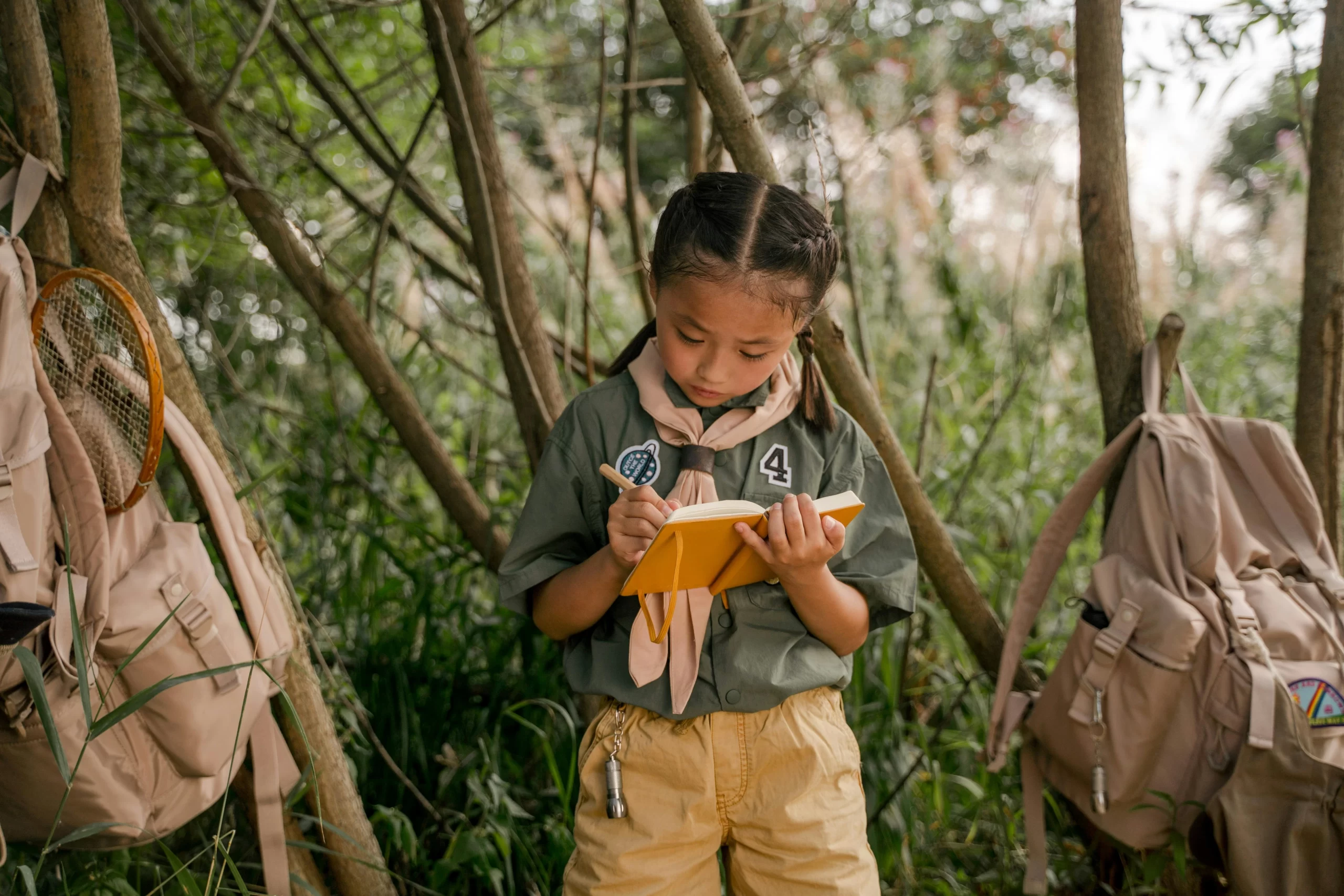 A young athlete taking notes and writing a journal.