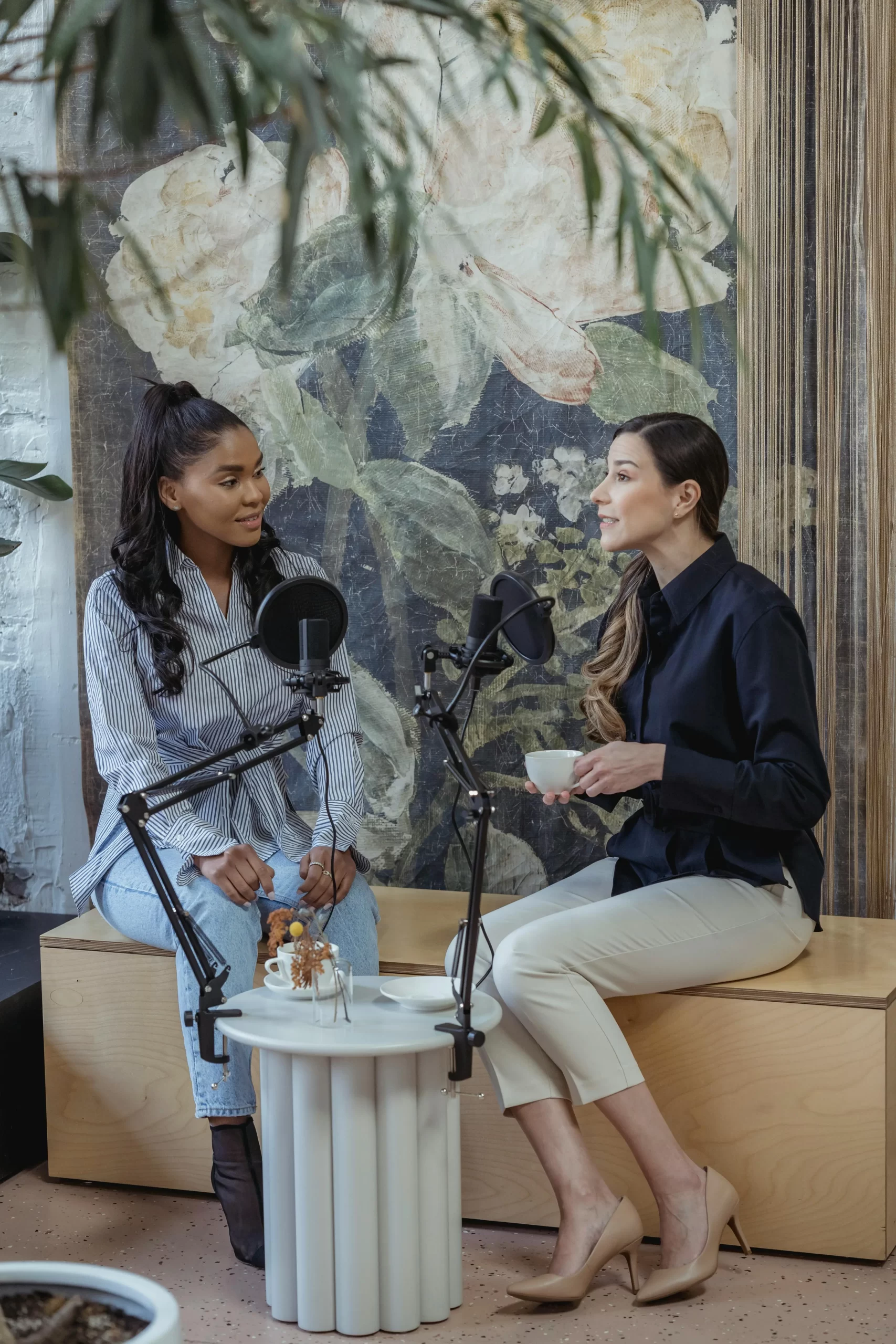 Mother and daughter talking about sports, podcast style.