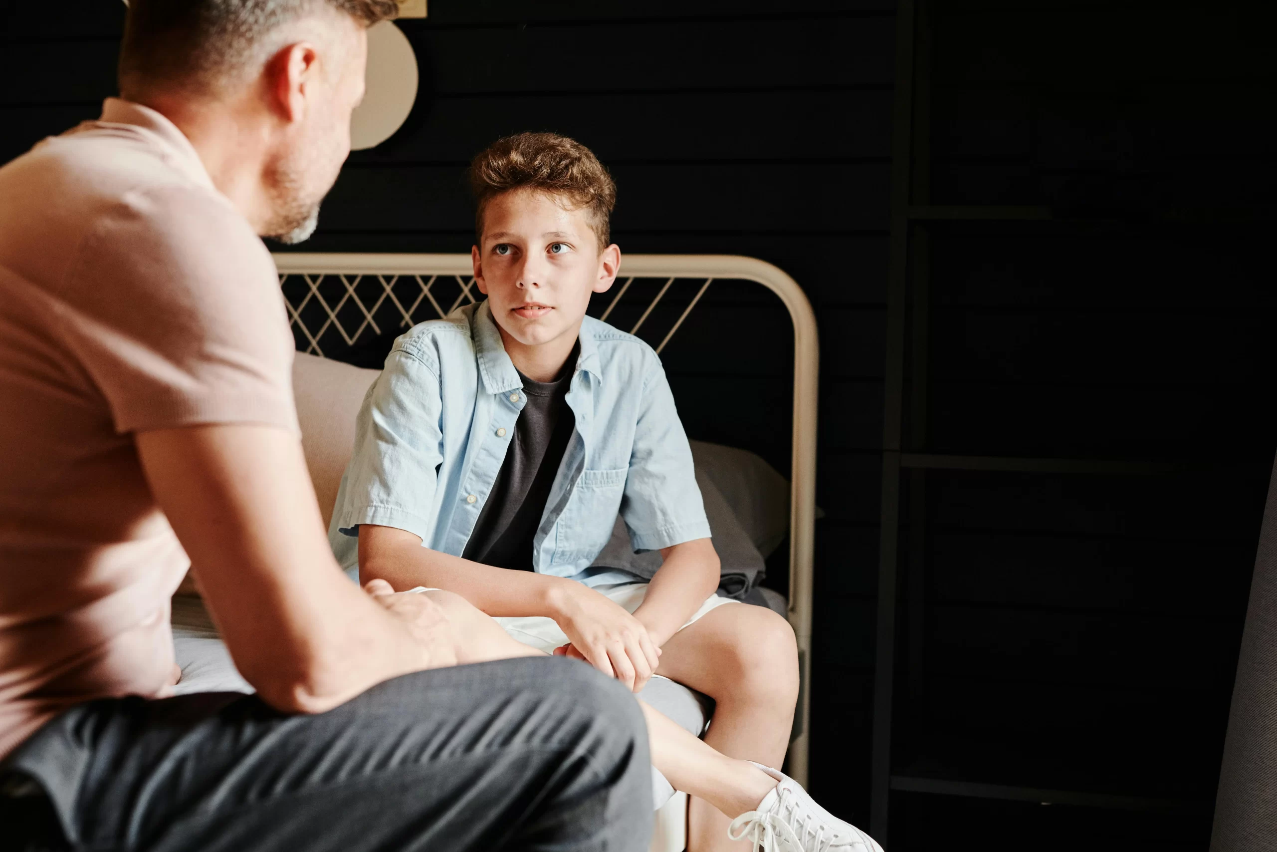 Father and son talking about sports.