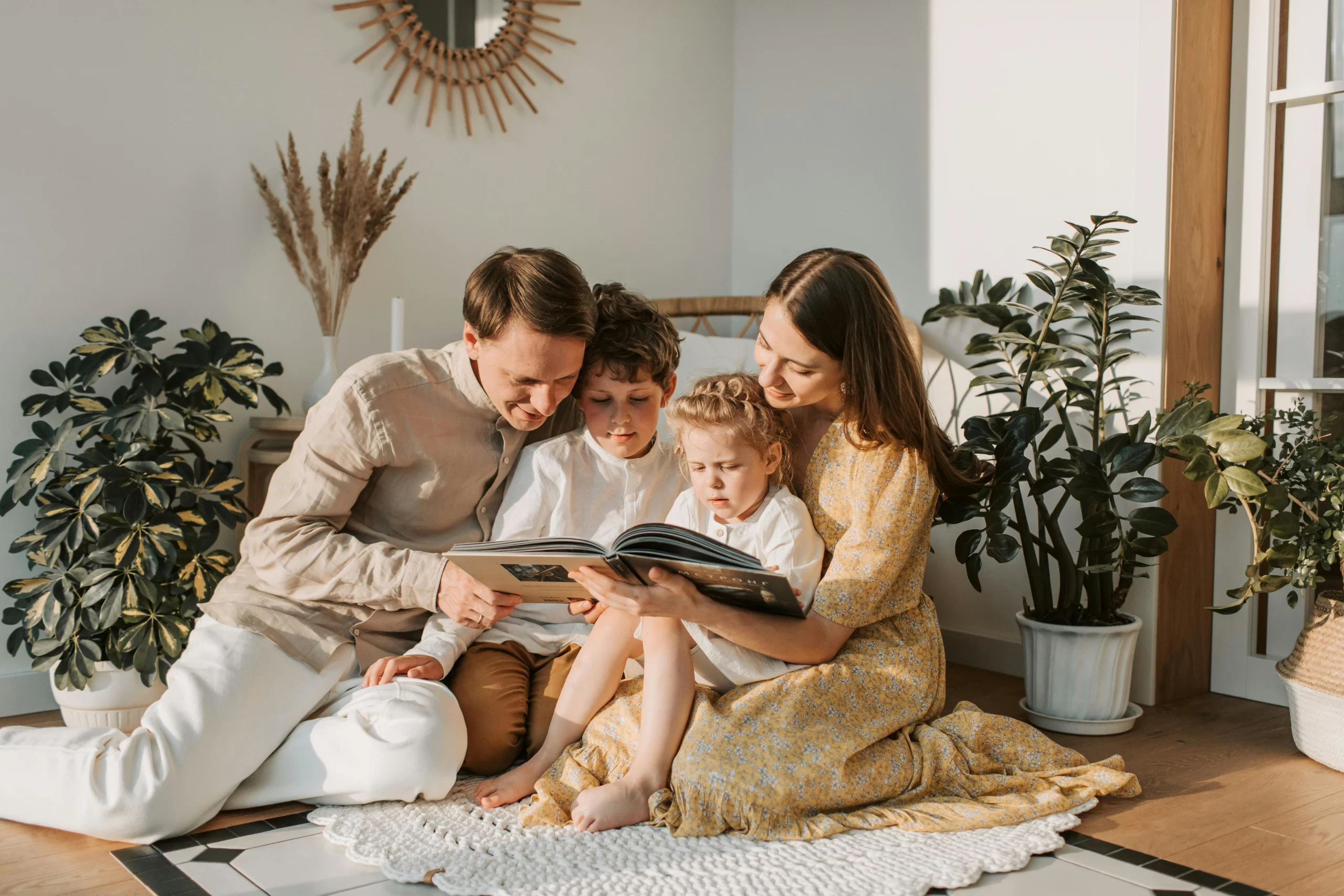 A family reading a book together.