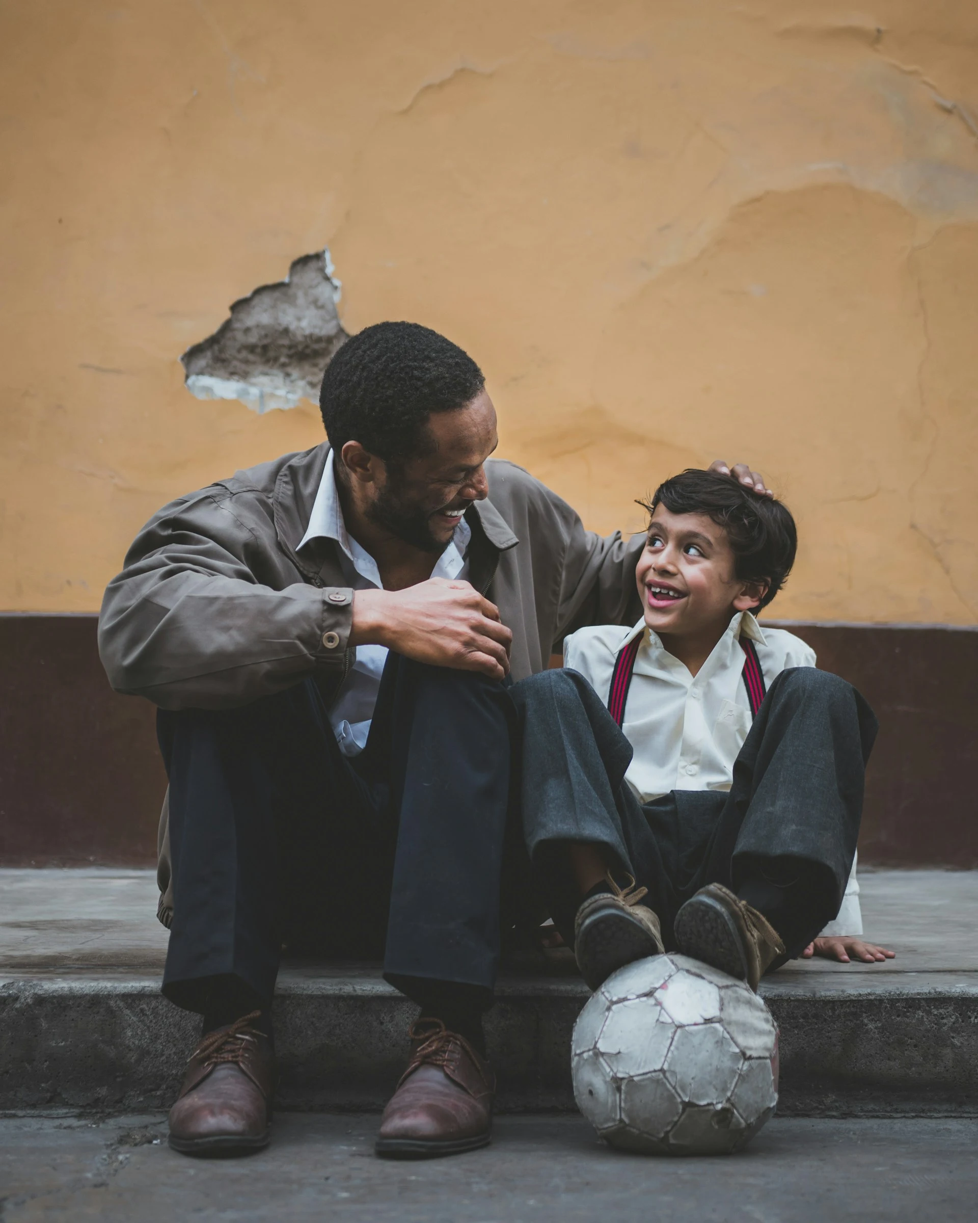 A father encouraging his son.